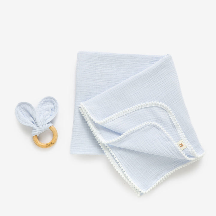 JBØRN Pop Pom Swaddle Organic Muslin Blanket & Teether Set Muslin Powder Blue - Personalisable Baby Products Sold and Personalised by JustBørn