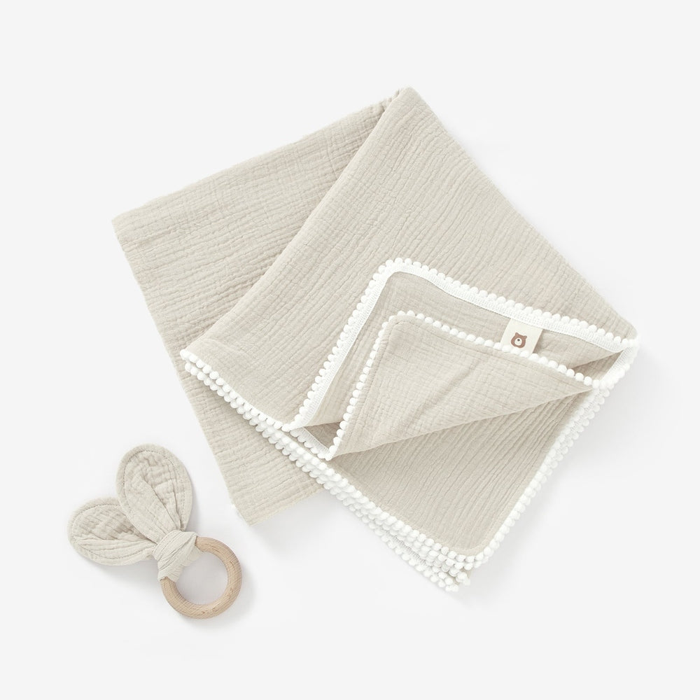 JBØRN Pop Pom Swaddle Organic Muslin Blanket & Teether Set | Personalisable in Muslin Sandstone, sold by JBørn Baby Products Shop, Personalizable by JustBørn