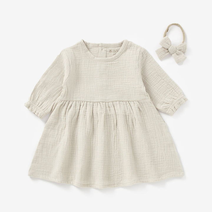 JBØRN Organic Cotton Muslin Baby Girl Dress and Bow | Personalisable in Muslin Sandstone, sold by JBørn Baby Products Shop, Personalizable by JustBørn