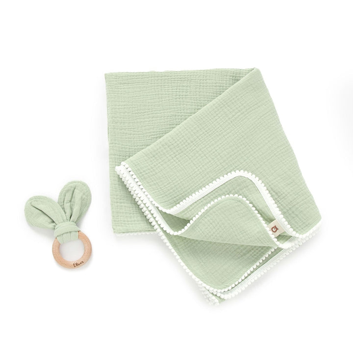 JBØRN Pop Pom Swaddle Organic Muslin Blanket & Teether Set | Personalisable in Muslin Pistachio, sold by JBørn Baby Products Shop, Personalizable by JustBørn