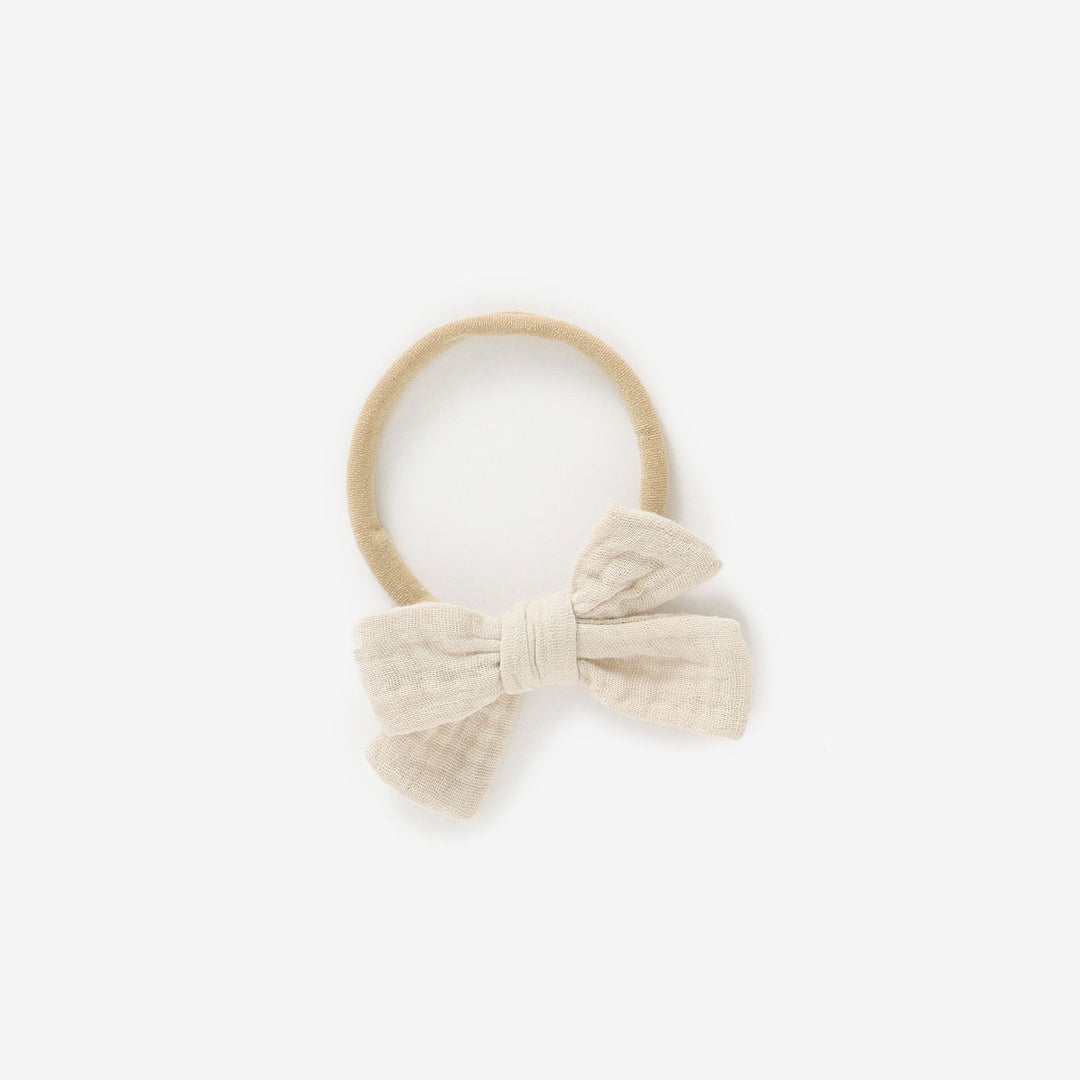 JBØRN Organic Cotton Muslin Baby Bow Headband in Muslin Sandstone, sold by JBørn Baby Products Shop, Personalizable by JustBørn