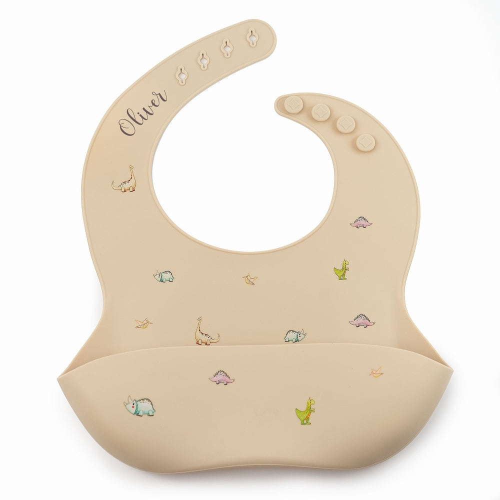 JBØRN Silicone Baby Feeding Bib | Weaning Essentials | Personalisable in Dinosaurs Beige, sold by JBørn Baby Products Shop, Personalizable by JustBørn